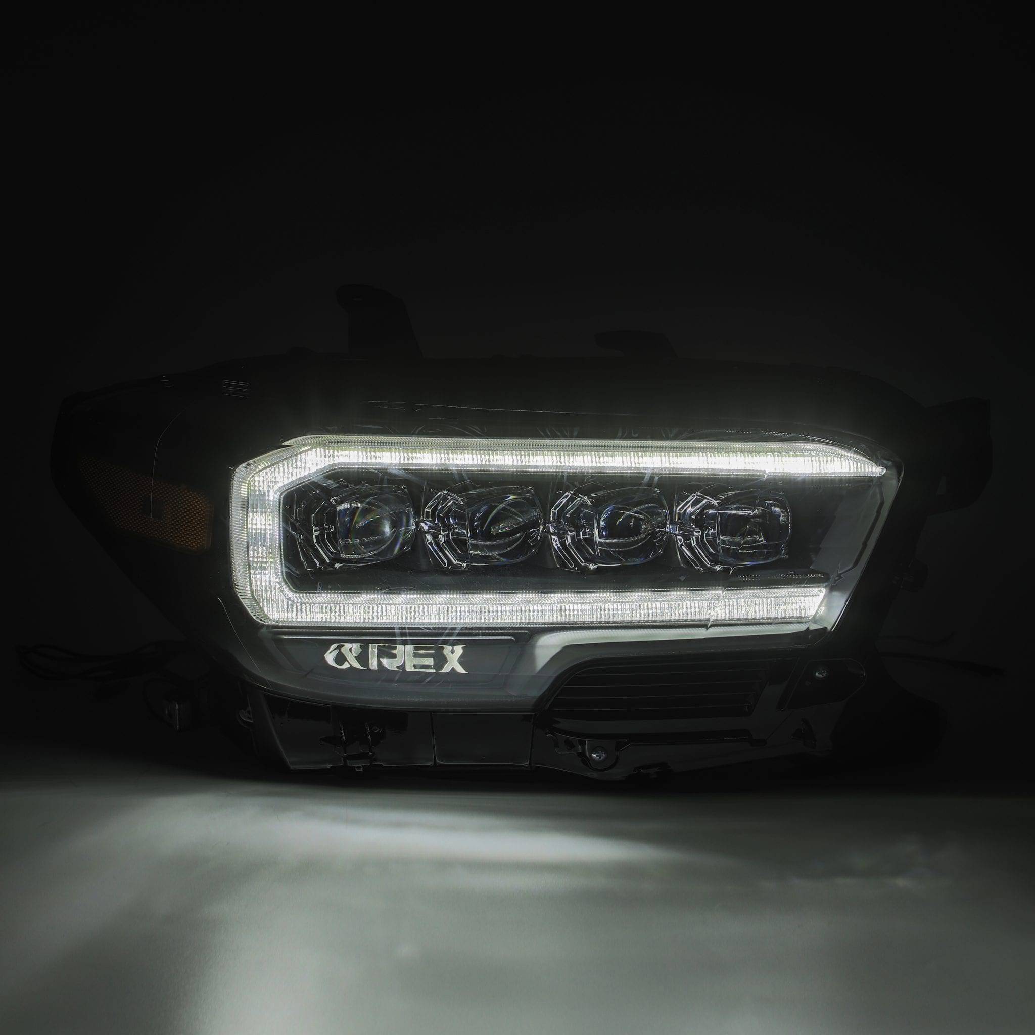 16-23 Toyota Tacoma NOVA-Series LED Projector Headlights Alpha-Black - Legends Auto Parts